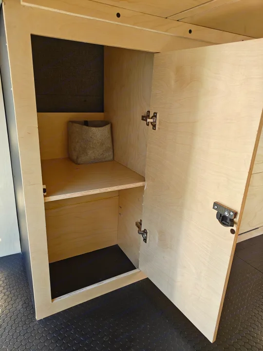 RV rental plywood cabinet with open door, shelf, and a felt bin. Ideal campervan storage for organization.. Mercedes-Benz Sprinter 2017
