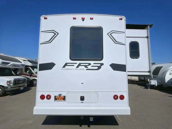 White Forest River FR3 RV rental, rear view. El Monte RV plate holder visible on a sunny lot.. FR3 FR3 Motorhome 2024