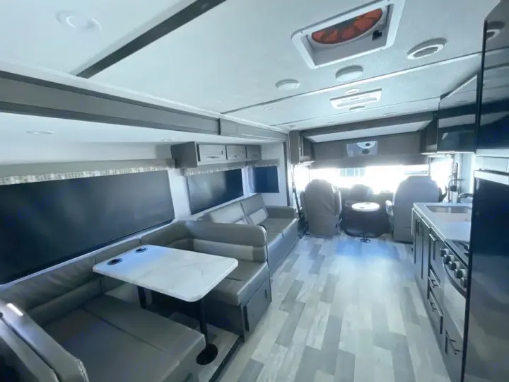 Spacious RV rental interior: modern living area, dinette, kitchen, and driver's cockpit.. FR3 FR3 Motorhome 2024