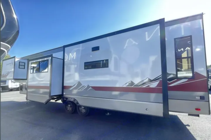 Modern fifth-wheel rv rental with extended slide-outs and mountain graphics, ready for camping adventures.. FOREST RIVER Campsite Elite 36RF 2026