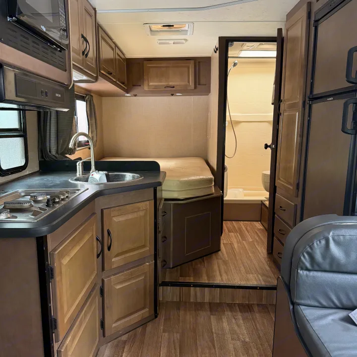 This rv rental offers a full kitchen with stove/sink, a sleeping area, and a private shower/toilet for comfortable journeys.. Thor Motor Coach Four Winds Majestic 2018
