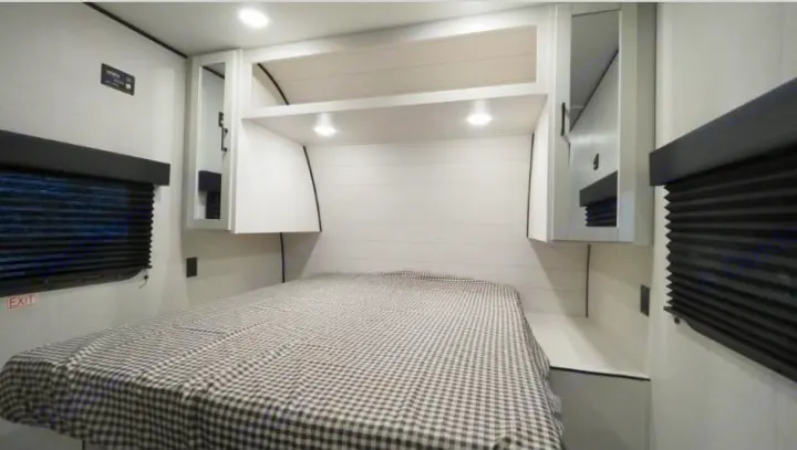 RV rental: Bright, modern bedroom with a comfortable bed, convenient overhead storage, and blackout blinds.. Jayco Jay Flight SLX 260BH 2026