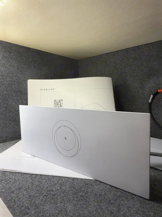 Starlink router/base and instructions in an RV rental. Setting up high-speed internet in a felt-lined mobile space.. Holiday Rambler Nautica 2021
