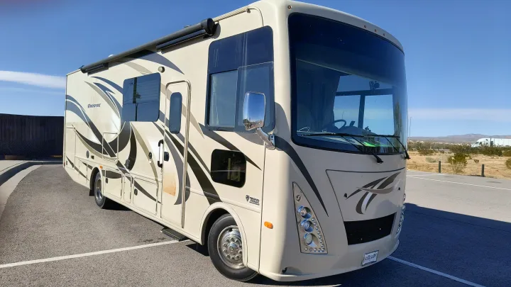 Spacious Thor Windsport rv rental parked under a clear sky, ready for adventure.. Thor Windsport 2017