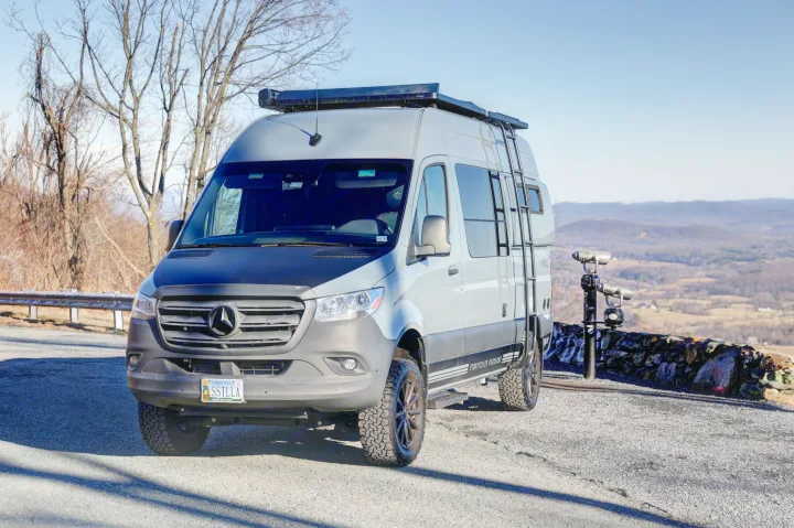 Storyteller Overland RV rental: Sprinter van parked at a Virginia mountain overlook with scenic views.. Mercedes-Benz Sprinter 2021