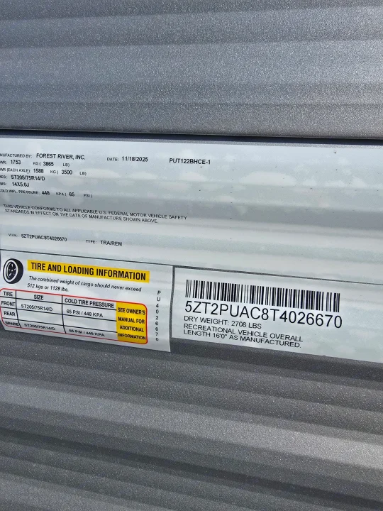 Essential RV rental info: VIN 5ZT2PUAC8T4026670, tire pressure (65 PSI), cargo & dry weight, and length 16'0".. Palomino Puma Camping Edition 122BHCE 2026
