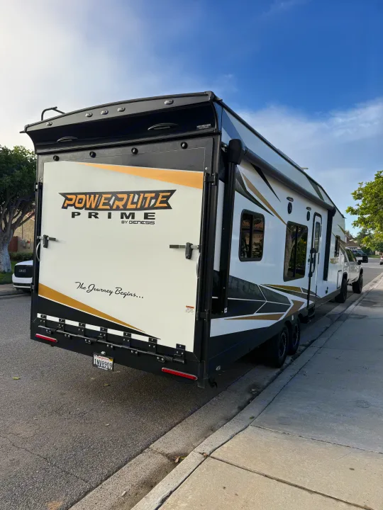 Powerlite Prime toy hauler travel trailer, an ideal rv rental for your next adventure. "The Journey Begins...". Genesis Supreme Powerlite LE Toy Hauler 2022
