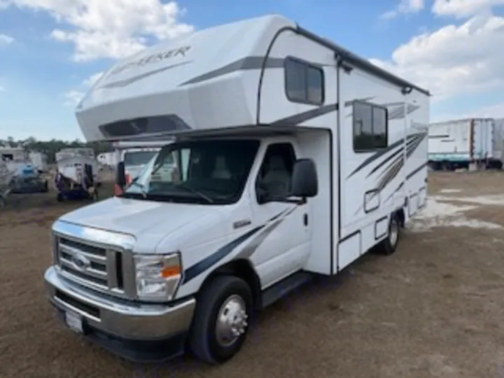 This white Forest Seeker Class C RV rental, parked on a dirt lot, is ready for your next motorhome adventure.. Forest River Sunseeker LE 2024