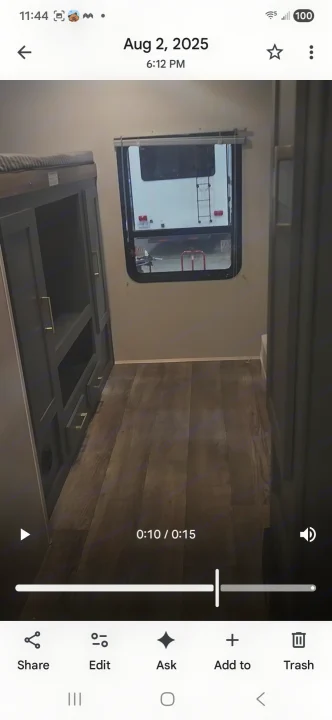 RV rental interior: bunk bed, dark grey storage unit with gold handles, light walls, and a window looking out. Wood-look floor.. Eddie Bauer Eddie Bauer 2024