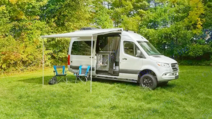 Explore nature with this silver RV rental camper van! Features an awning, outdoor chairs, and a kitchenette for adventure camping.. Thor Motor Coach Sprinter 4X4 Tranquility 2023