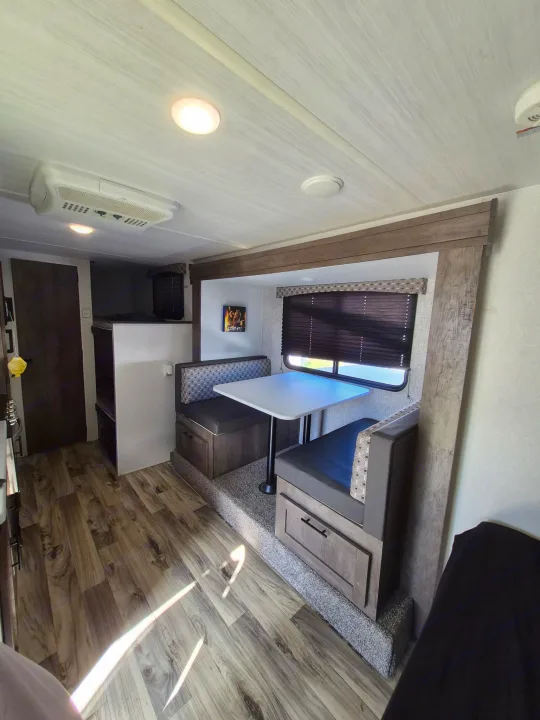 Tour an RV rental! This modern interior features a dinette, bunk beds, and AC for comfortable family adventures.. Forest River Sonoma 2020