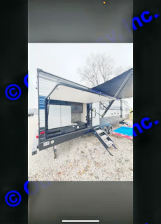 Discover this rv rental travel trailer, showcasing an open outdoor kitchen, extended awning, and convenient entry stairs.. Forest River Cherokee 2020