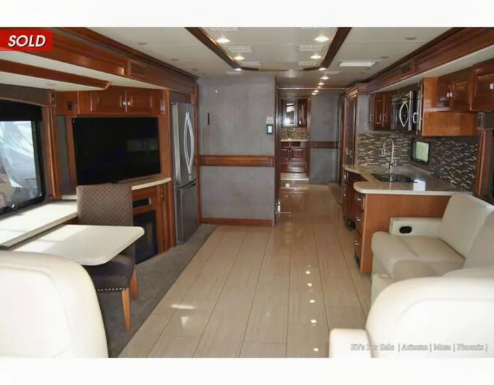 Luxury RV rental interior: fully equipped kitchen, dining, and living spaces with modern design and ample room to relax.. Holiday Rambler Endeavor 2018