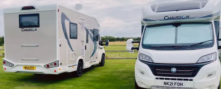 Two Chausson RVs parked in a field, ready for an rv rental adventure. Ideal for travel & camping.. Chausson 720 VIP Titanium 2021