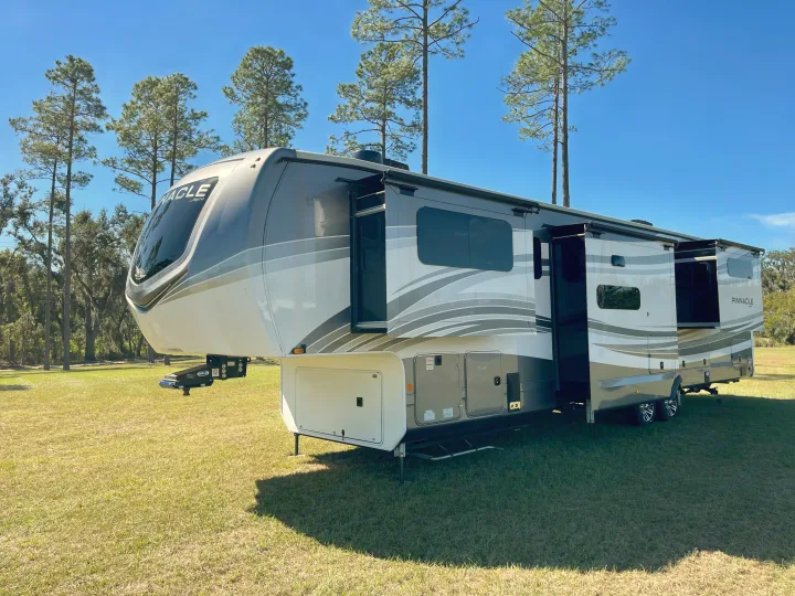 This spacious fifth-wheel RV rental, a modern camper with extended slide-outs, is ready for an outdoor adventure.. Jayco Pinnacle 2023