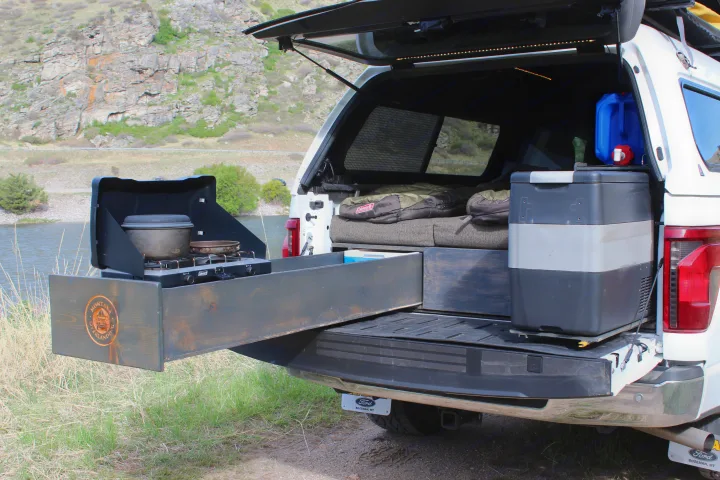 Explore with an RV rental! This truck bed camper boasts a pull-out kitchen, fridge, water, and sleeping bags for rugged adventure.. Ford Ford F150 2024