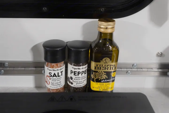 Salt, pepper, & olive oil essentials in an rv rental kitchen, ready for your next adventure.. A Liner Scout 2026