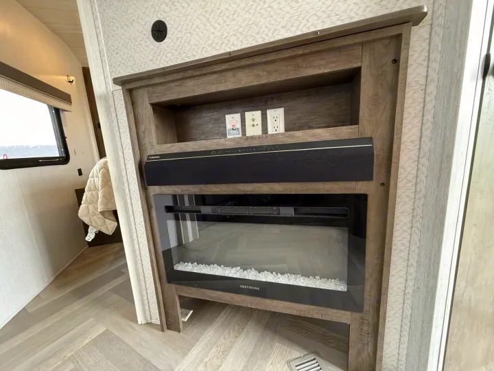 RV rental: modern entertainment unit with a Furrion soundbar, Greystone electric fireplace, and power/cable outlets.. Forest River Salem 2022