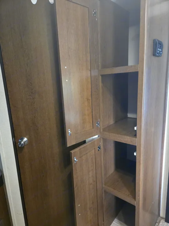 RV rental interior features ample wood grain storage with cabinets & open shelves.. Avenger ATI 2019