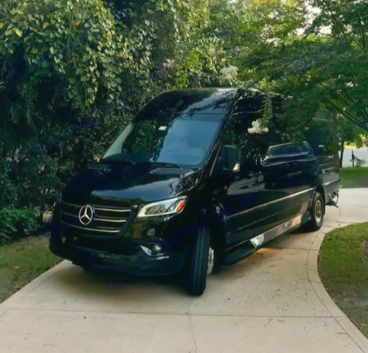 This sleek black Mercedes-Benz Sprinter luxury conversion van, ideal for an RV rental adventure, is parked on a driveway.. Ultimate Toys Ultimate Coach 2024