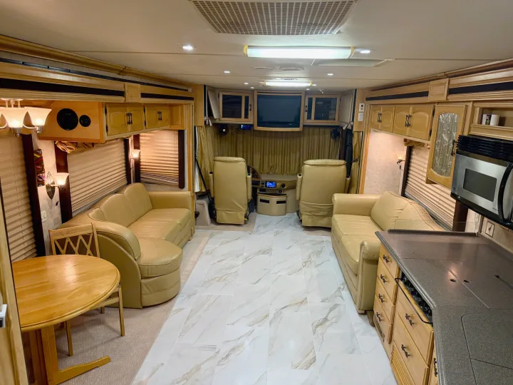 Step inside this luxurious RV rental featuring a spacious living area, full kitchen, and stylish interior finishes.. Fleetwood Excursion 39s 2005