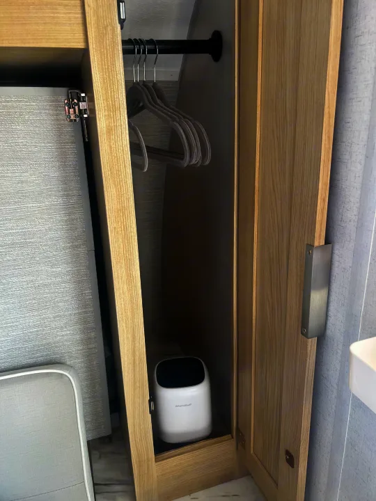 RV rental closet with hangers & dehumidifier. Compact storage for clothes & moisture control.. Forest River Salem FSX 2023