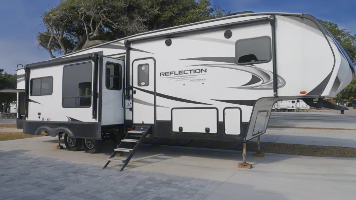 This white Reflection Grand Design fifth-wheel RV camper is set up and ready for your next rv rental adventure!. Grand Design Reflection 2022
