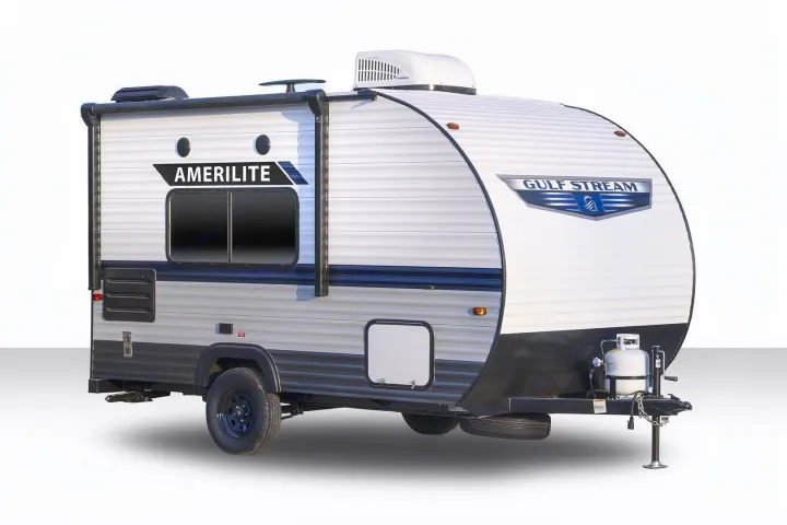 This Gulf Stream Amerilite travel trailer, an ideal rv rental, features an AC unit, awning, and propane tank for outdoor adventures.. Gulf Stream Ameri-Lite Super Lite 2023
