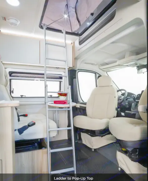 RV rental interior: Ladder to pop-up top. This cozy camper van features light seating, windows & overhead storage.. Coachmen Pixel 2025