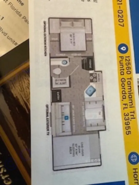 This RV rental floor plan displays a spacious layout with bedroom, bath, kitchen, living, and a cab-over bunk sleeping area.. Thor Chateau 2023