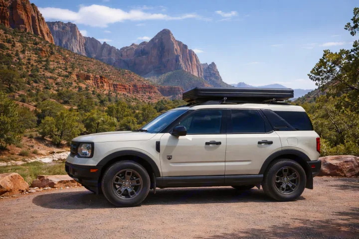 SUV with rooftop tent, an RV rental alternative for mountain adventures.. Ford Bronco Sport 2024