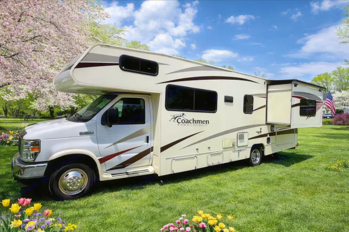 RV rental: A Coachmen Freelander Class C motorhome on a spring lawn. Blooming trees, colorful flowers, and an extended slide-out.. Forest River Coachmen Freelander 2017