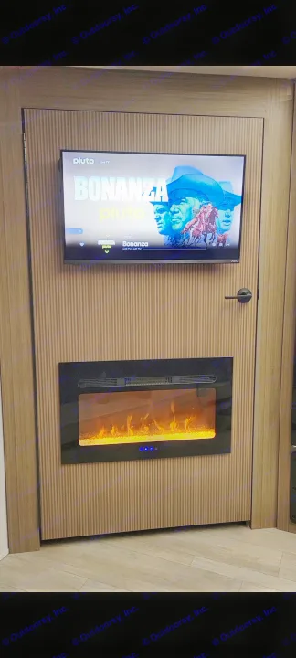 Cozy RV rental interior: a TV showing Bonanza on Pluto TV above a glowing electric fireplace, set on a stylish ribbed wall.. Forest River Salem Cruise-Lite 2026