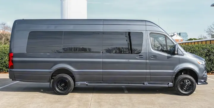 Gray Mercedes-Benz Sprinter van rv rental. Side view of the customized campervan with tinted windows and off-road tires.. Mercedes Benz Executive Lounger by Legends Sprinter 3500XD 170 2023