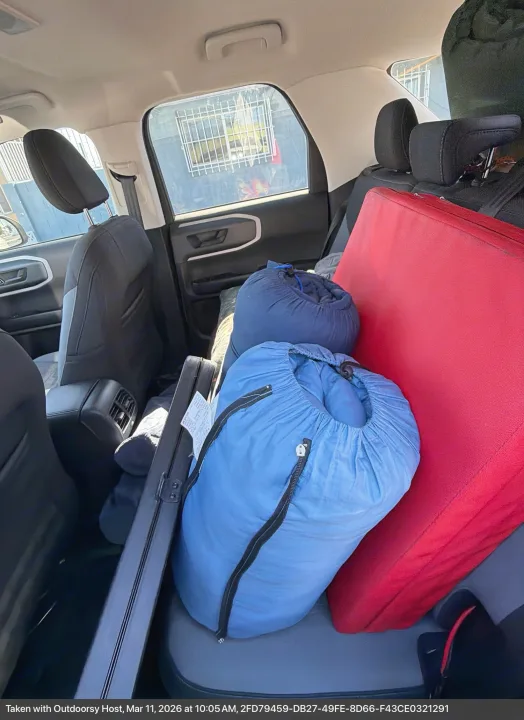 RV rental: Vehicle packed with blue sleeping bags and a red pad, ready for an outdoor adventure.. Ford Bronco Sport 2024