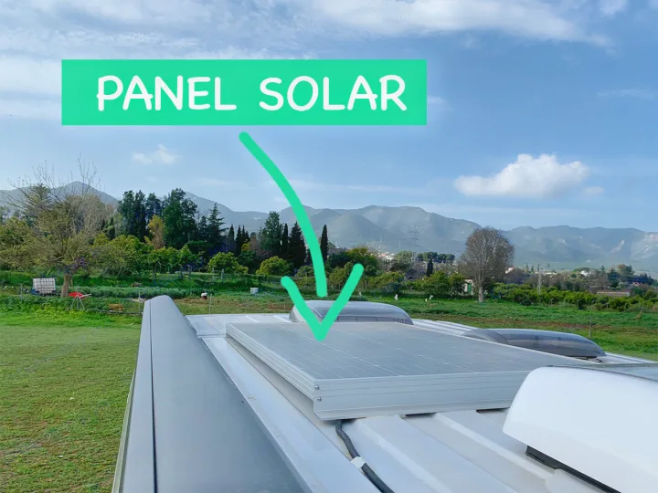 This rv rental features a roof-mounted solar panel for off-grid power, set against a backdrop of green mountains.. Sunlight Cliff 600 2023