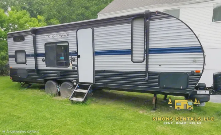 A modern Grey Wolf travel trailer RV rental with steps down, parked on green grass. Perfect for exploring with Simons Rentals LLC.. Forest River Cherokee Grey Wolf Special Edition 2020