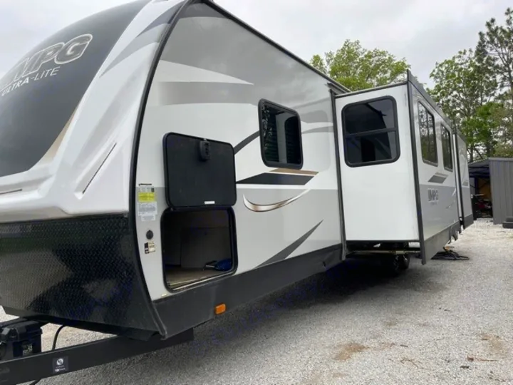 This white & gray MPG Ultra-Lite travel trailer RV rental has an extended slide & front storage. Ready for adventure!. Cruiser RV MPG Ultra Lite 2021