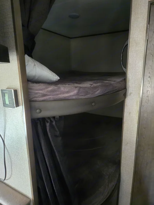 Cozy RV rental bunk beds with soft blankets & Dometic control panel for a comfortable stay.. Jayco Jay Flight SLX 2021