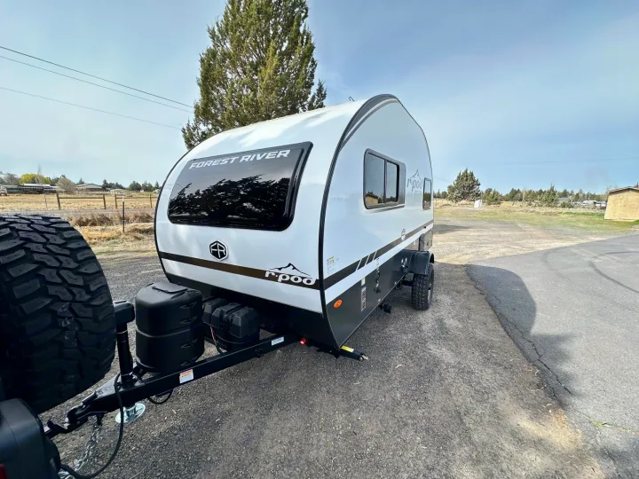 Modern Forest River R-Pod travel trailer, ideal for your next rv rental adventure. Features off-road tires and a compact design.. Forest River RPod 2026