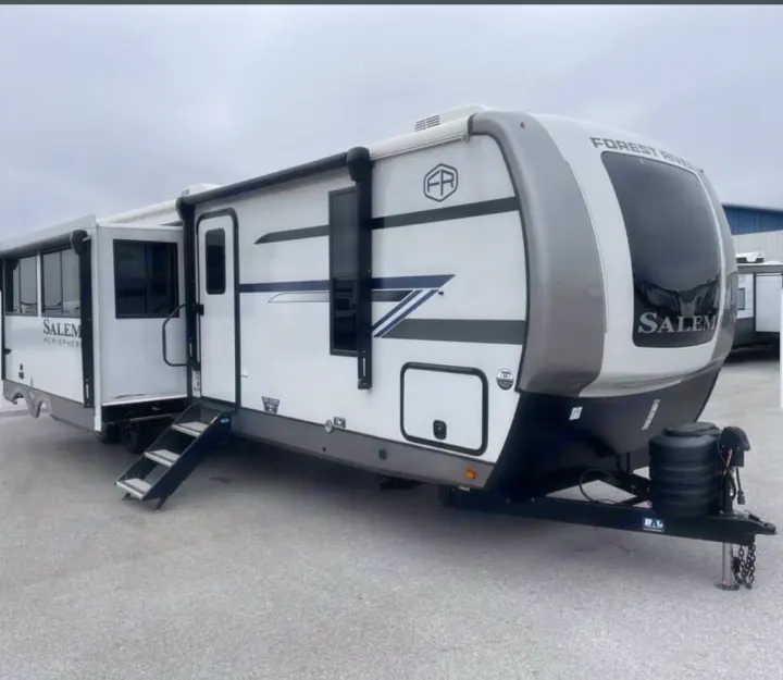 White Forest River Salem Hemisphere RV rental, slide-out extended, steps down. Perfect for your next travel adventure.. Forest River Salem Hemisphere 2026