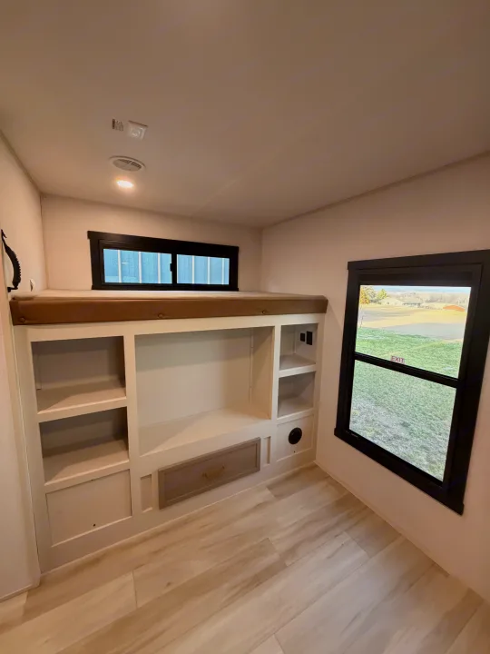 This RV rental offers a spacious bunk bed with built-in storage and two windows, ideal for a comfortable family adventure.. Forest River Salem Hemisphere 2026