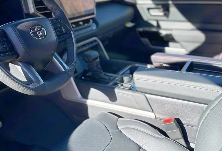 Start your RV rental adventure in style. View this modern Toyota interior: steering wheel, console, & comfy seat.. Toyota Tundra TRD Off Road 2026