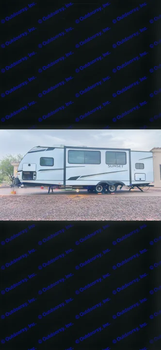 A modern white Sunset Trail travel trailer is parked on a gravel lot, ready for an RV rental adventure.. Keystone RV Sunset Trail 2024
