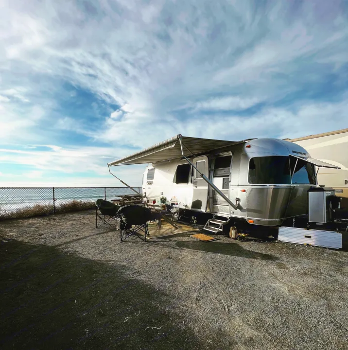 This stunning Airstream rv rental offers beachfront camping, complete with an extended awning and ocean views.. Airstream Pottery Barn 2023
