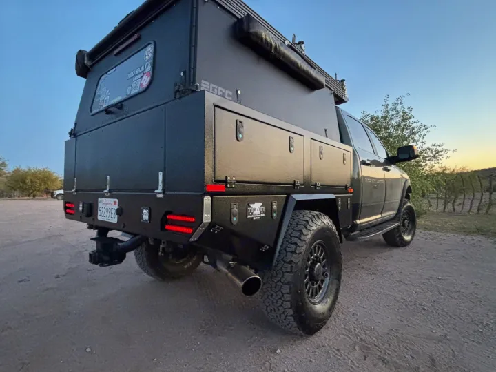 This rugged, black off-road truck with a GFC overland camper is an ultimate **rv rental** for remote adventures.. Ram Power Wagon 2020