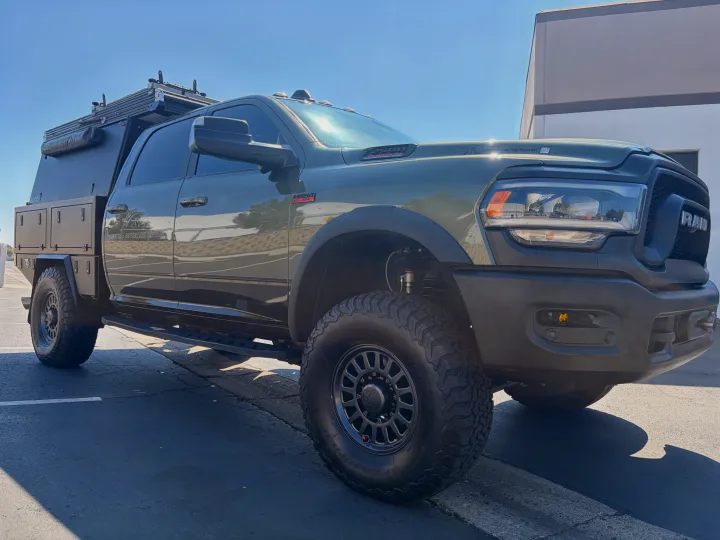 Green Ram 2500 overlanding rig with a flatbed camper, ready for adventure as an rv rental from La Jolla Adventure Rentals.. Ram Power Wagon 2020