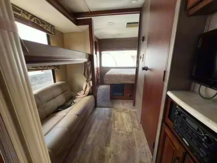Inside this cozy rv rental, discover bunk beds, a sofa, and a main bedroom area, complete with an entertainment center.. Forest River forester 2017