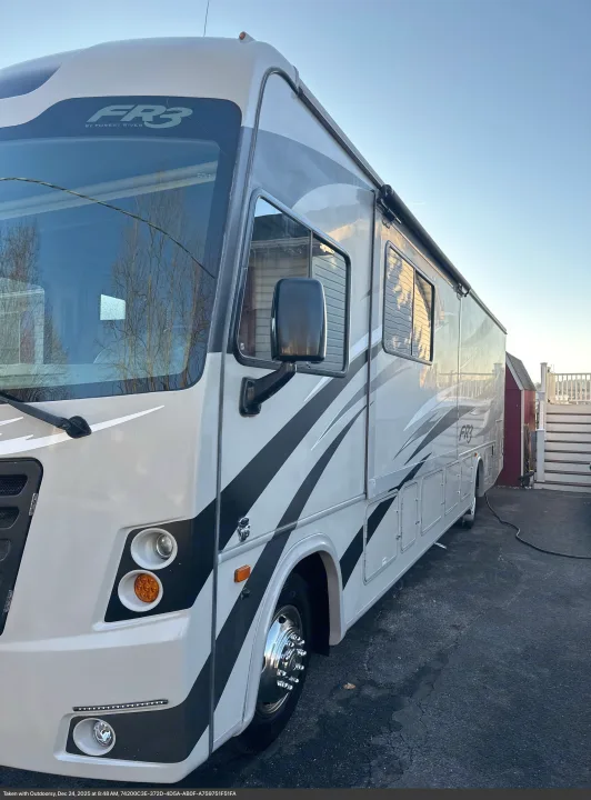 White and grey Forest River FR3 RV rental, a modern motorhome parked outside on a sunny day, ready for outdoor travel.. Forest River FR3 2017