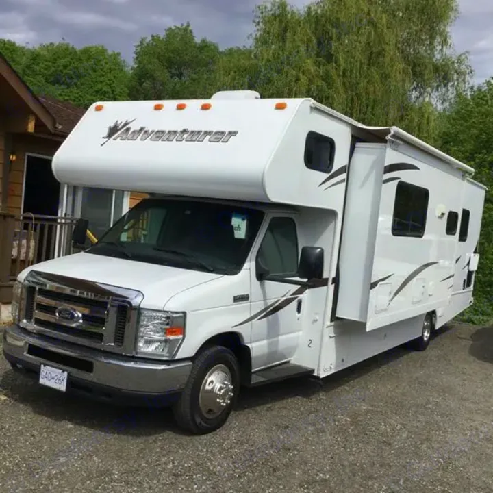 White Class C Adventurer RV rental, extended slide-out visible, ready for camping adventures.. Sunseeker 2650 2014